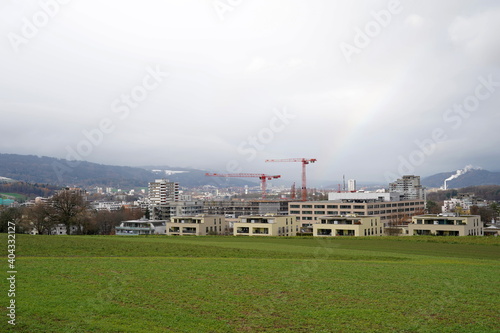 Schlieren, Switzerland: 12 14 2020: Limmattal hospital and its second building in construction. In background there are other settlements of Limmat valley or Limmattal in German in Switzerland. photo