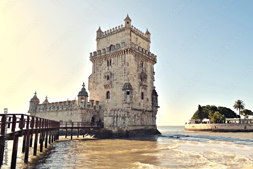 view of the historic Belem tower located in Lisbon in Portugal. It is a fortified tower declared a UNESCO World Heritage Site and being the symbol of the city it is highly appreciated by tourists