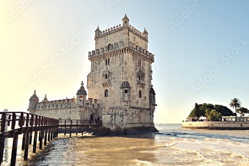 view of the historic Belem tower located in Lisbon in Portugal. It is a fortified tower declared a UNESCO World Heritage Site and being the symbol of the city it is highly appreciated by tourists