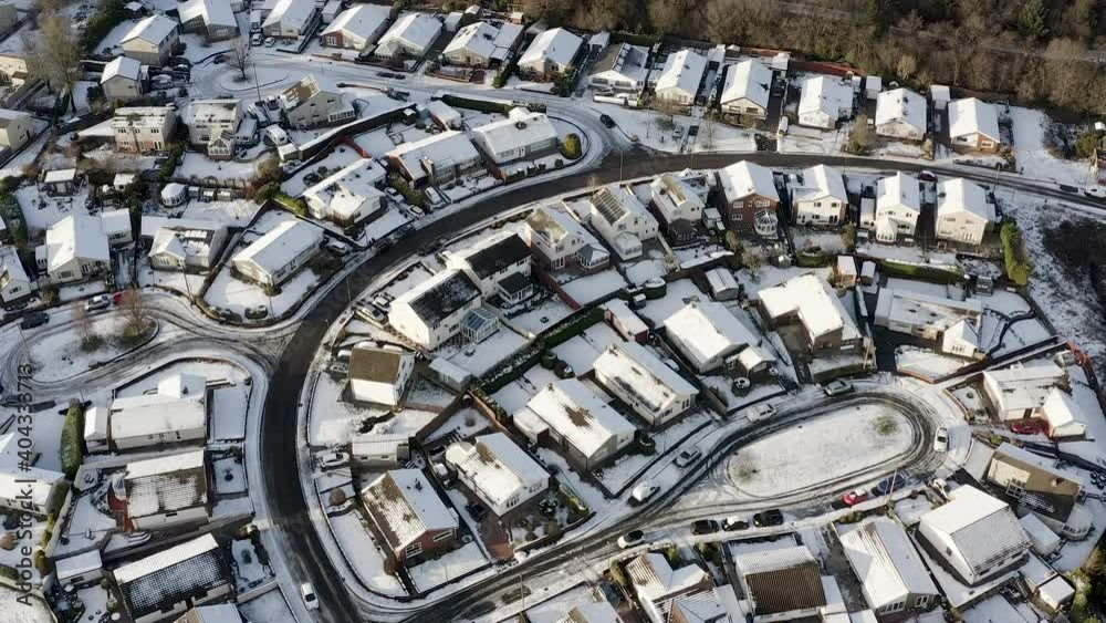 Aerial view of snowy streets and houses in winter Aerial view of snowy streets and houses in winter