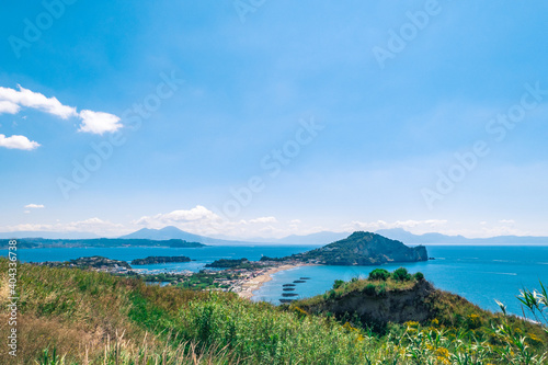 view of the sea in the gulf of Naples from Monte di Procida with the volcano Vesuvius in the background and Bacoli closer