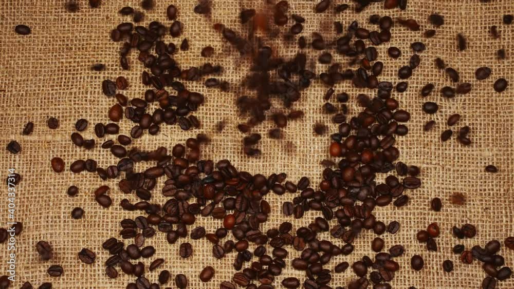 Roasted coffee beans arranged in the form of coffee cup logo. Roasted coffee beans arranged in the form of coffee cup logo.