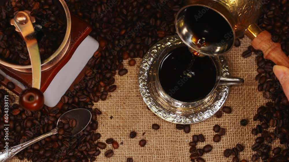 Turkish coffee pouring from a cezve.
