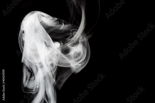 Fototapeta Naklejka Na Ścianę i Meble -  Nature Abstract: The Delicate Beauty and Elegance of a Wisp of White Smoke
