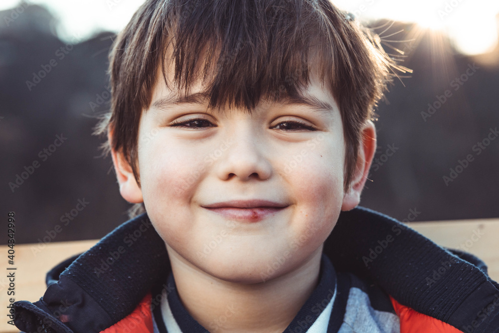 Portrait of a cute, little boy with bangs, smiling Portrait of a cute, little boy with bangs, smiling