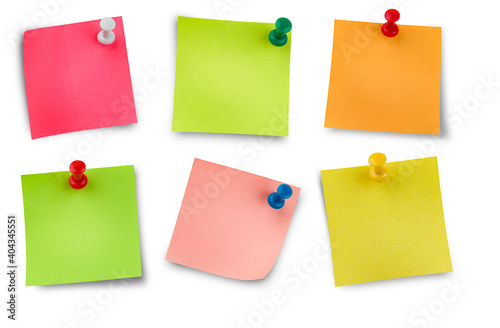 six colored stickers on thumbtacks. isolated white background