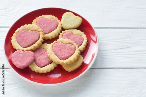 Valentine's day cookies on a plate Step by step 5. Cooking instructions. Love concept. Homemade heart shaped cookies. Delicious natural organic cookies, baked goods with love for valentines day