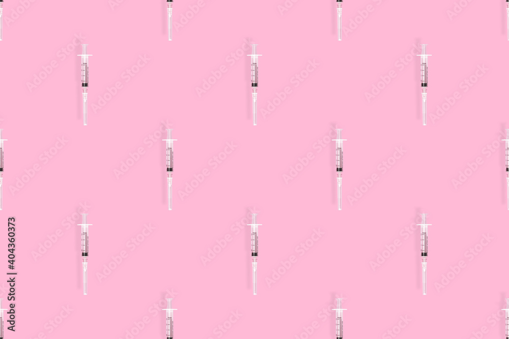 Medical syringes seamless pattern. Medical syringes on a pink background. Medical syringes seamless pattern. Medical syringes on a pink background.