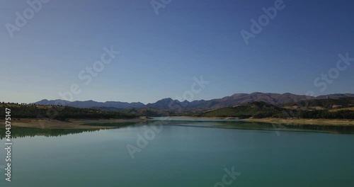 Aerial view of a lake in a barren and dry landscape in Extremadura in southern Spain