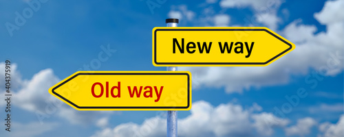 street signs pointing in different directions with the message NEW WAY and OLD WAY in front of a cloudy background