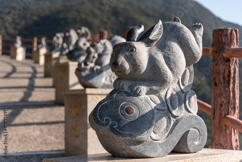 Stone statue of the Year of the Rabbit in GuangDong GuanYin mountain national forestpark of china.Sculpture of the Chinese Zodiac.
 photo