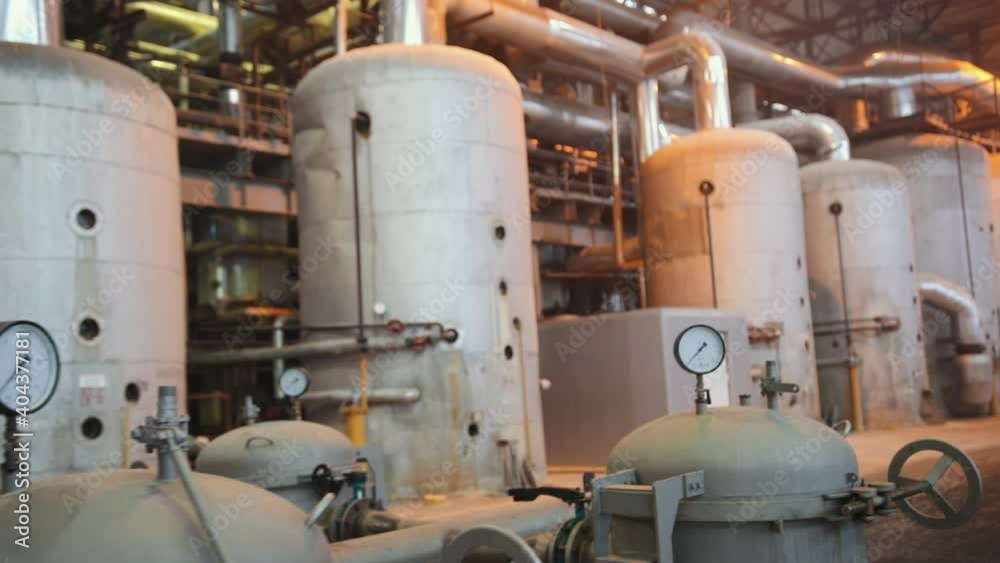 Manometer pipes and valve in boiler room. Thermal power plant piping at modern factory. Sugar beet production plant Manometer pipes and valve in boiler room. Thermal power plant piping at modern factory. Sugar beet production plant