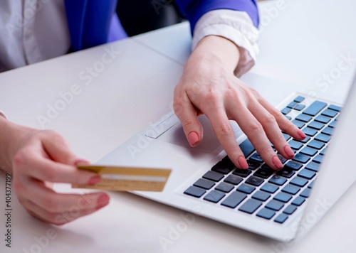 Woman buying online with credit plastic card