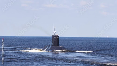 A line ahead of modern russian military naval battleships warships with submarine in the row, northern fleet and baltic sea fleet, summer sunny day, vibrant image photo