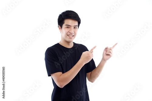 young man pointing space isolated on white