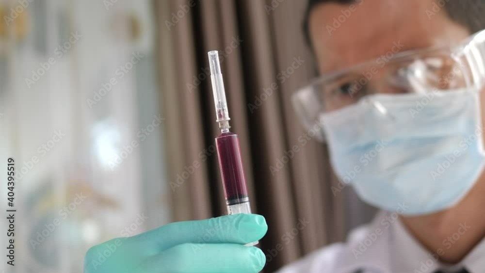 Doctor in mask with syringe Check for viruses Doctor in mask with syringe Check for viruses