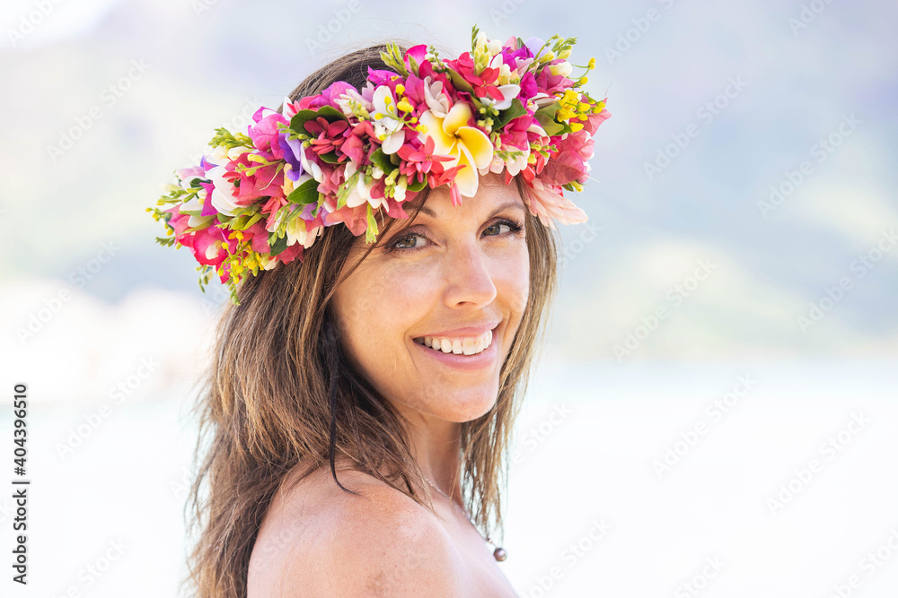 Woman wearing colorful flower crown on vacation at beautiful tropical island Bora Bora in French Polynesia Woman wearing colorful flower crown on vacation at beautiful tropical island Bora Bora in French Polynesia