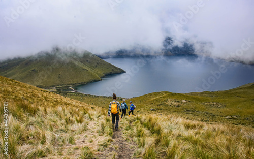Trekkers at the beautiful Lagunas de Mojanda from the Fuya Fuya trail, Otavalo, Ecuador photo