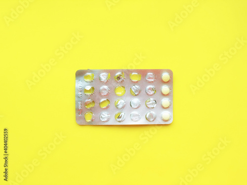 Fotografie, Obraz Directly Above Shot Of Blister Pack On Yellow Background