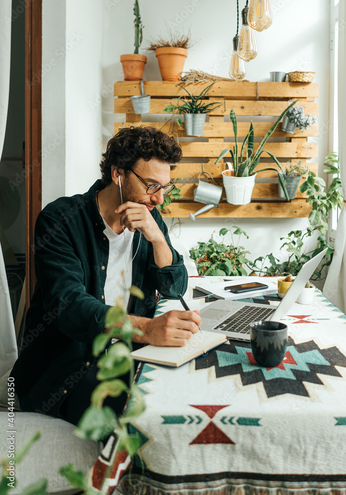 Fotografie Man with laptop working remotely from home