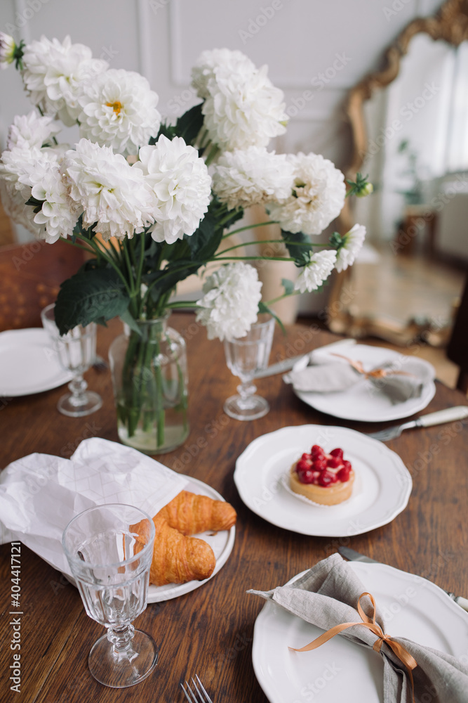 Fototapeta premium Table setting for tea with desserts. Waiting for guests concept.