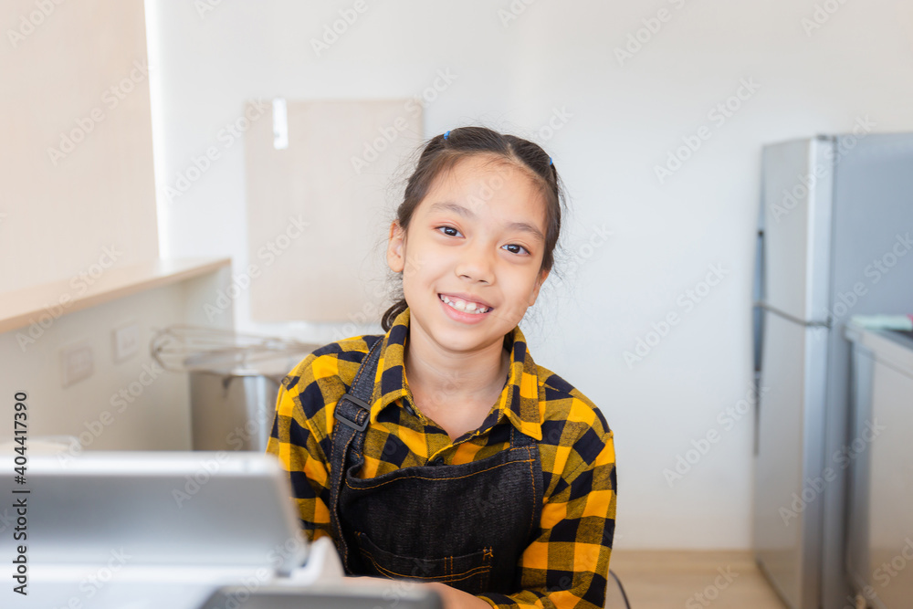 Smiling little girl cashier operating at the cash desk in cafe, education concept Smiling little girl cashier operating at the cash desk in cafe, education concept