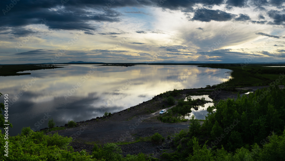 Khabarovsk region. Beautiful sunset on the river named Amur. The Amur River near Ommi near the city of Amursk Khabarovsk krai.