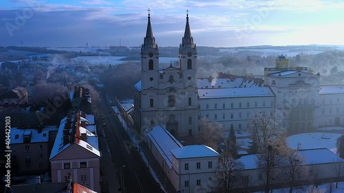 Amazing aerial 4K footage about the Ciszterci abbey in Zirc city hungary. Fantastic snowy view in 2021 January. This is an historical religion building on upper Balaton region. photo