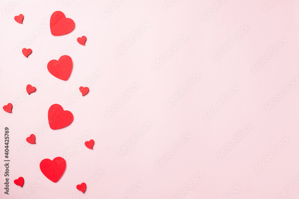 Valentines' day background. red hearts composition greeting card for love Valentines day concept isolated on pink background with copy space. Top View flat lay from above