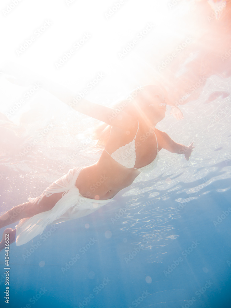 Fototapeta premium Woman underwater at the pool