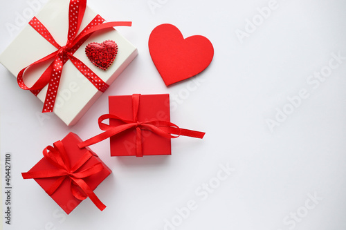 valentine s day background. valentine s day gift concept. gift box on a white background and a red heart.