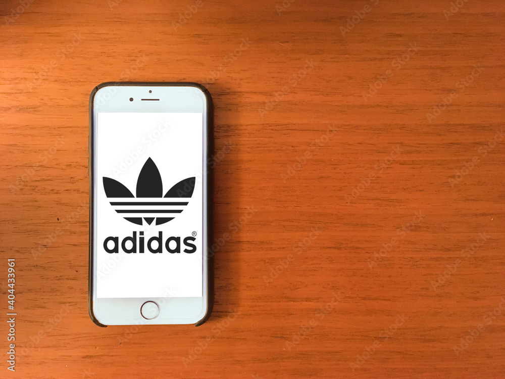 Adidas logo on mobile phone screen foto de Stock | Adobe Stock
