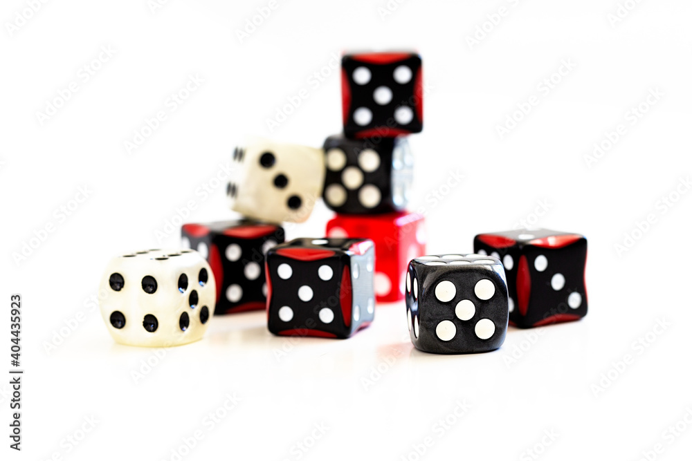 Selection of multi coloured dice on white background Selection of multi coloured dice on white background