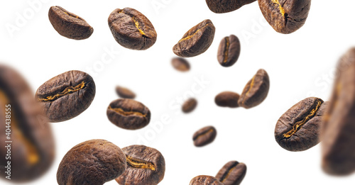 Coffee beans levitate on a white background © butenkow