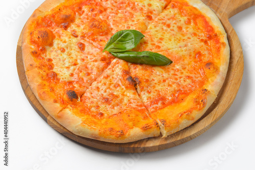 Traditional Pizza Margarita. Margherita pizza on wooden board isolated on white. Fast food, junk food concept.