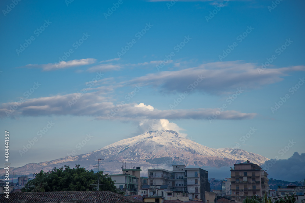 Etna with snow seen from the center of Catania
