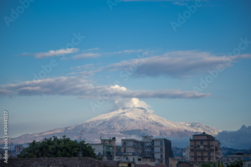 Etna with snow seen from the center of Catania