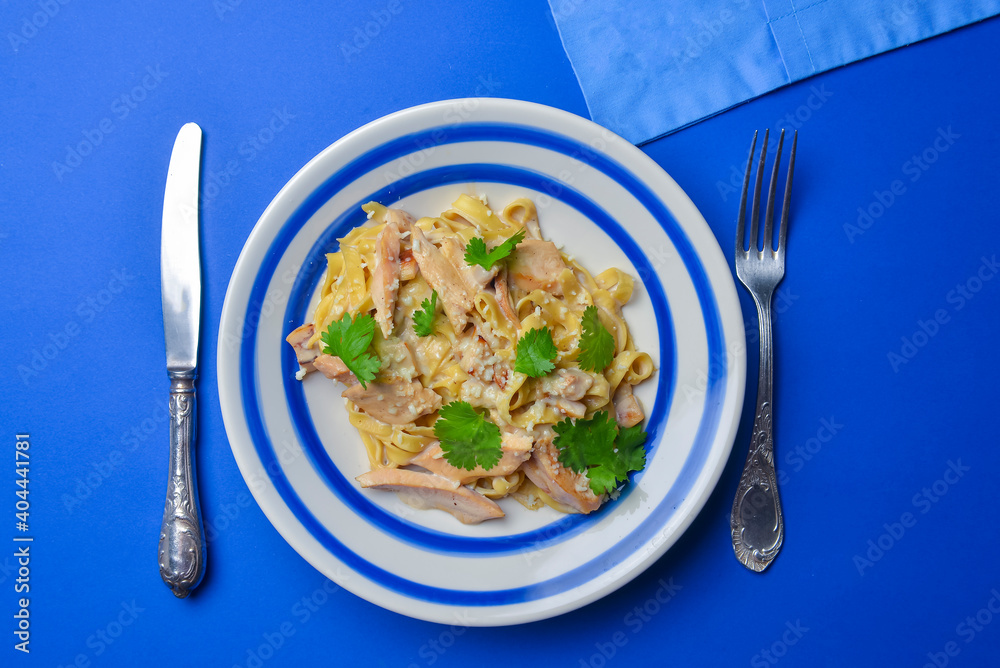 Pasta Penne with Chicken and Mushroom under Parmesan Cheese. Delicious Italian cuisine concept. Pasta Penne with Chicken and Mushroom under Parmesan Cheese. Delicious Italian cuisine concept.
