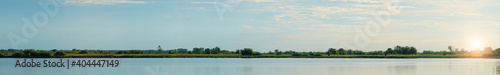Panorama evening on a Quiet lake with a forest background
