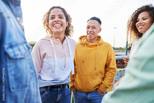 Group of young friends spending time together outdoors
