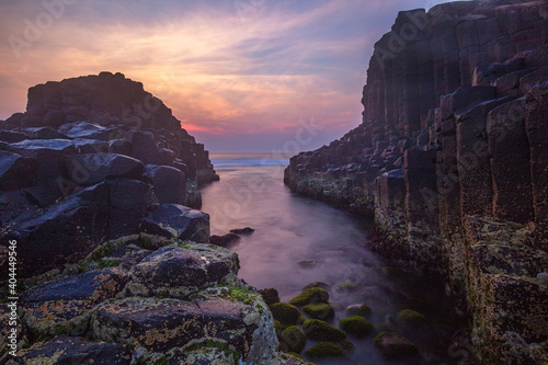 Colourful sunrise over Fingal Causeway . An amazing formation of basalt rock columns at Fingal Head ,Northern Rivers Region of N.S.W. Australia.
