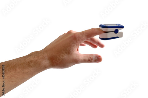 Pulse oximeter with hand of patient isolated on white background. Oximeter Device is used for measure pulse rate and oxygen levels. Tracking coronavirus symptoms