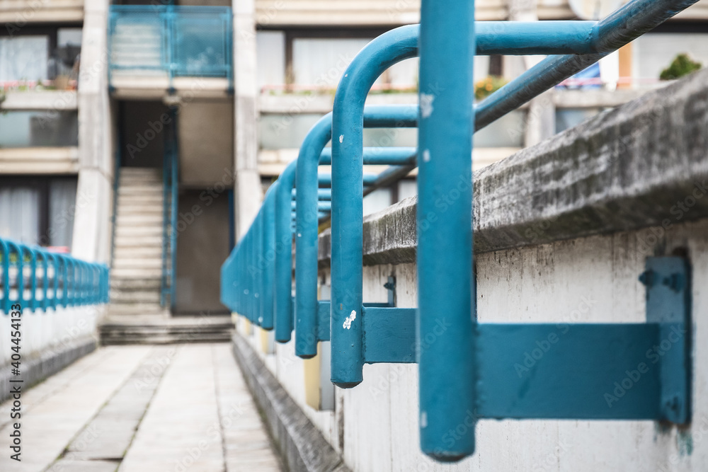Metal railings of concrete walkway at Alexandra Road estate, a brutalist architecture in London Metal railings of concrete walkway at Alexandra Road estate, a brutalist architecture in London