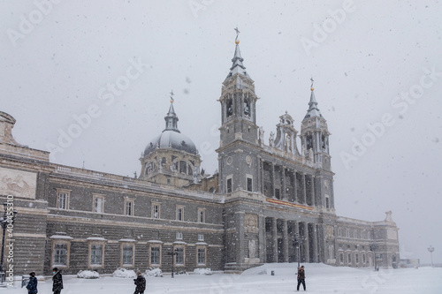Cathedral of Almudena in madrid theater covered by snow from the storm philomena