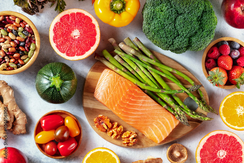 Superfood overhead flat lay shot. Salmon and asparagus, grapefruit and zucchini, legumes etc