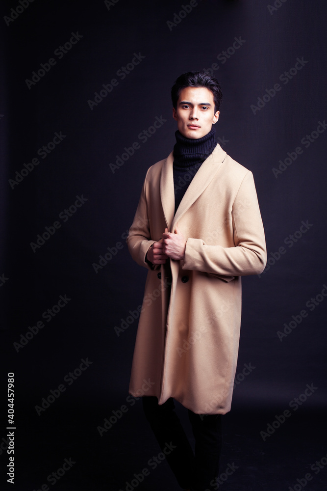 handsome asian fashion looking man posing in studio on black background, lifestyle modern people concept handsome asian fashion looking man posing in studio on black background, lifestyle modern people concept