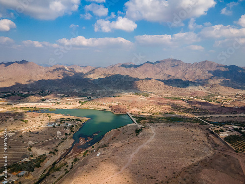 Photography Hatta town aerial cityscape surrounded by Hajar mountains in Hatta enclave of Du