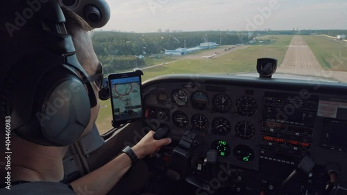 The pilot is landing the plane