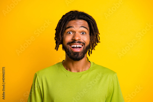 Photo of astonished dark skin guy scream impressed isolated over bright shine yellow color background © deagreez