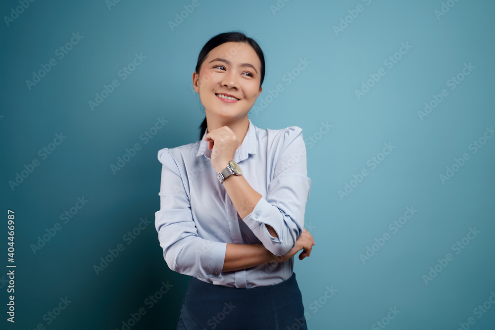 Asian woman happy surprised isolated on blue background. Asian woman happy surprised isolated on blue background.